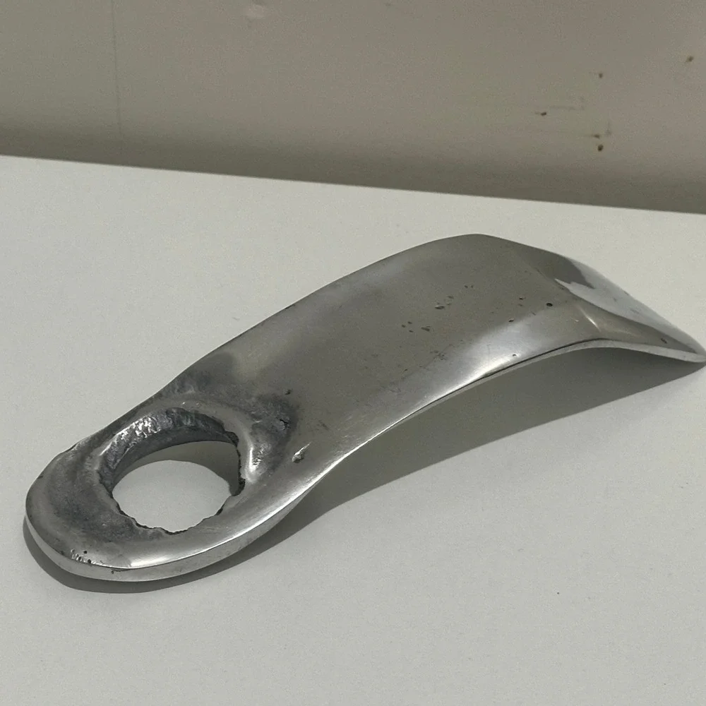 Freestanding wine bottle holder made from‎ recycled aluminum